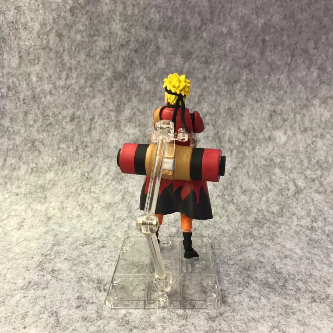 Figurine naruto uzumaki avec tete interchangeable et accessoires